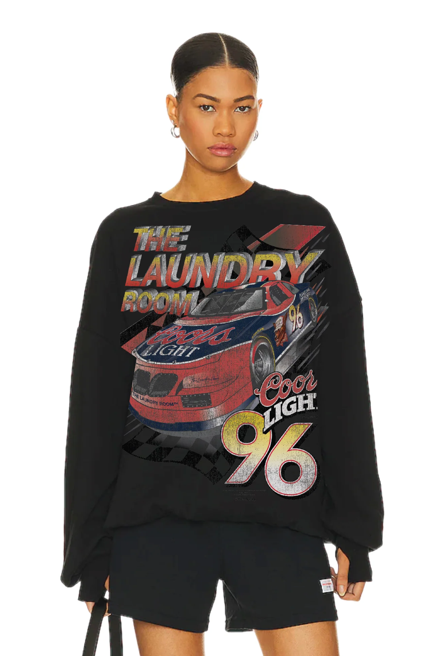 Person wearing a black sweatshirt with graphic design and text