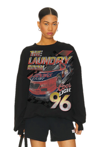 Person wearing a black sweatshirt with graphic design and text