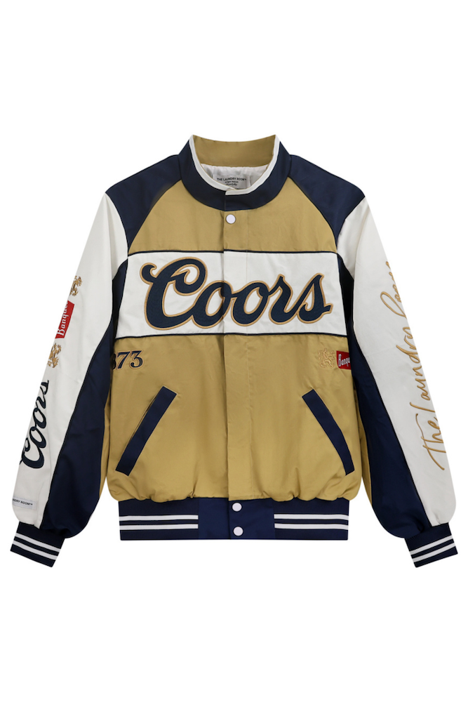 Coors branded jacket with beige, navy, and white colors on a white background